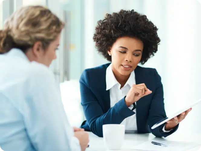 Two women talking at work