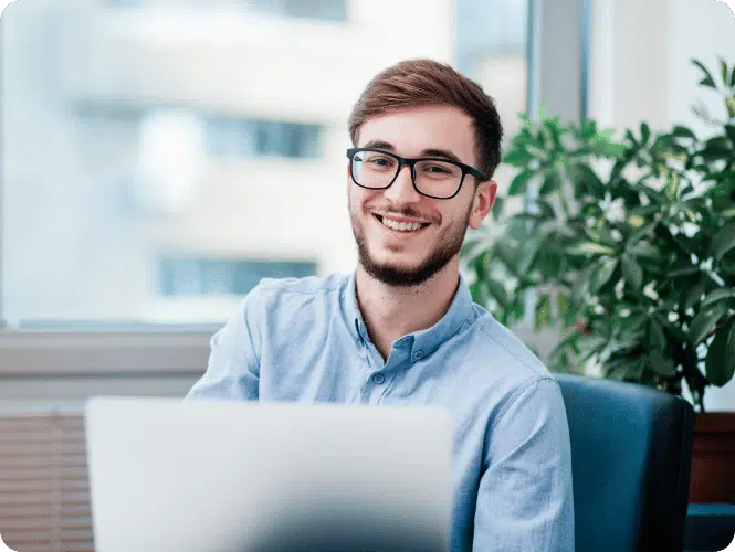 Man sat with a laptop discussing demystifying integrations in the financial sector.