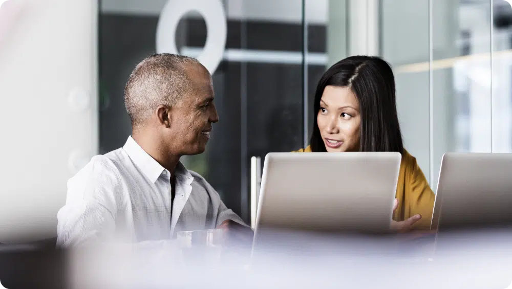 man and woman discussing work