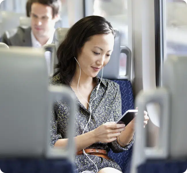 woman working from phone on a train
