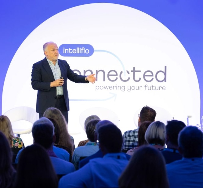 Speaker on stage at intelliflo connected event